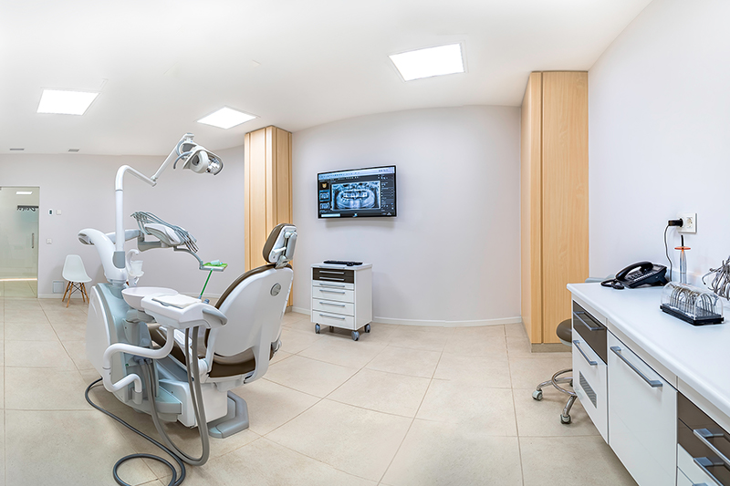 Panorama of a clean white modern dentist cabinet. Spacious room.